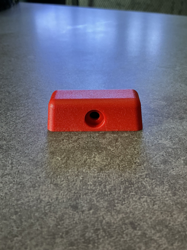 [85HB-E21850-AA] BOTON ROJO (SEGURO) PUERTA CARGO TODOS